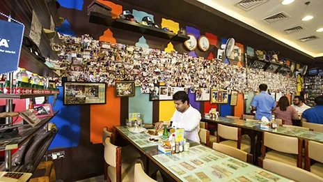 Diners at the table by the photo wall