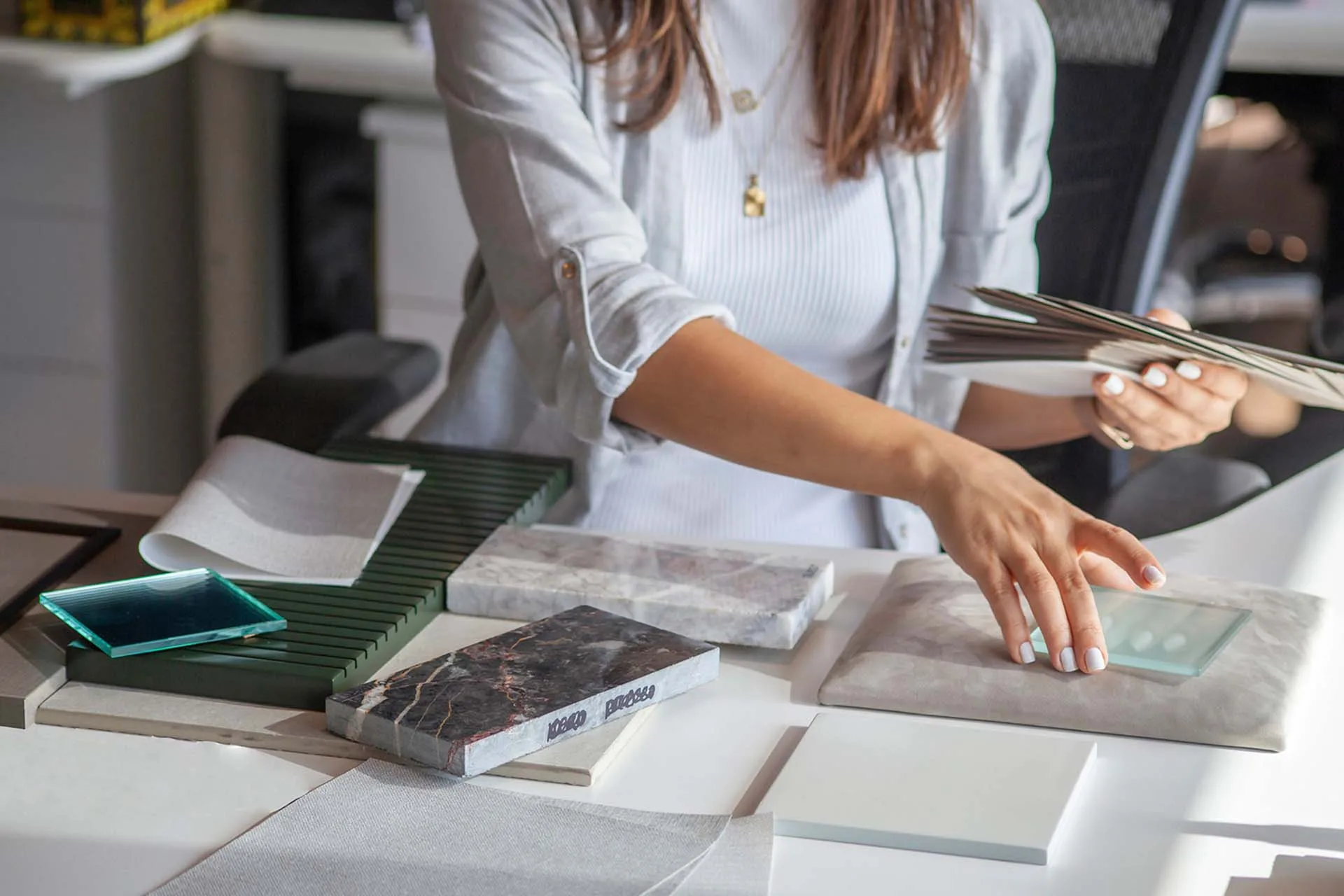 Designer reviewing material samples in the studio