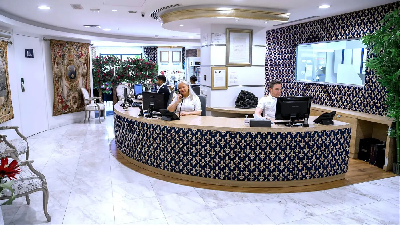 Reception of Versailles Dental Clinic — fleur-de-lys panelling, Al Razi Complex, Dubai Healthcare City.