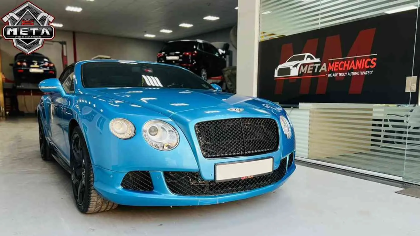 Bentley Continental in the Meta Mechanics workshop bay