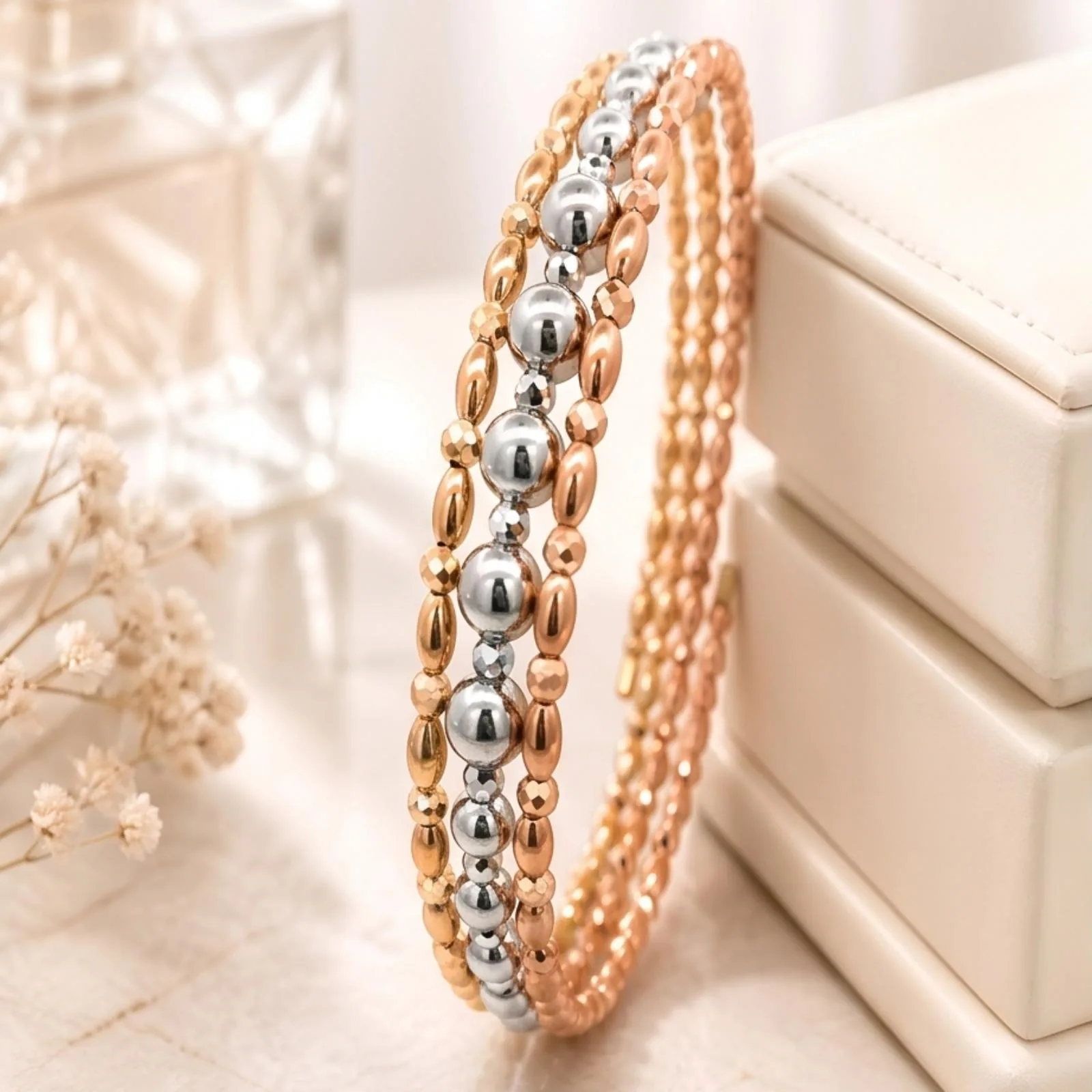 Tri-tone beaded bangle in rose, white and yellow gold
