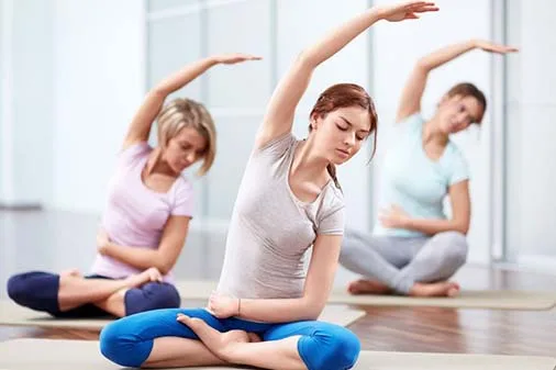 A small group practising yoga at the studio
