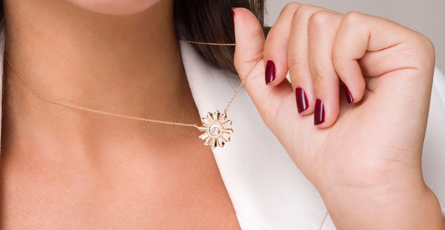 A Tala diamond necklace worn