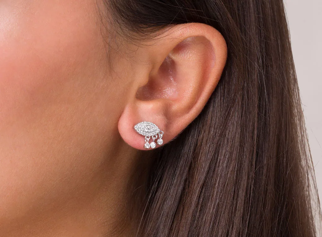 Diamond stud earring on the ear