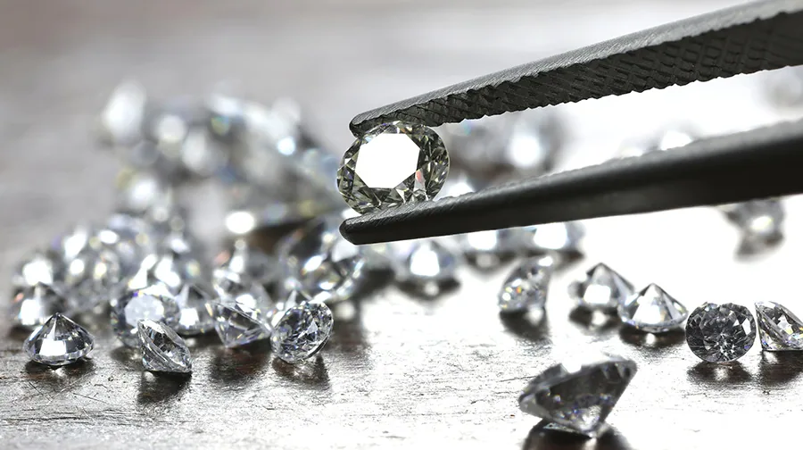 Loose diamonds being hand-selected