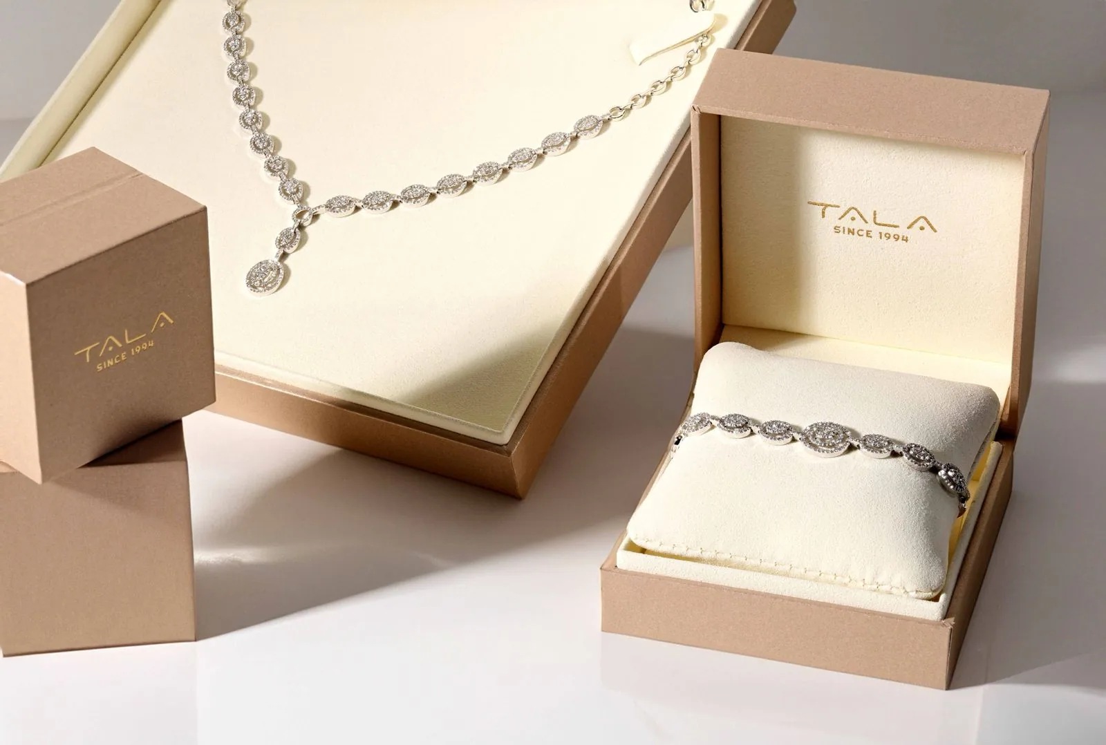 Tala Jewellery presentation boxes with a diamond necklace and bracelet