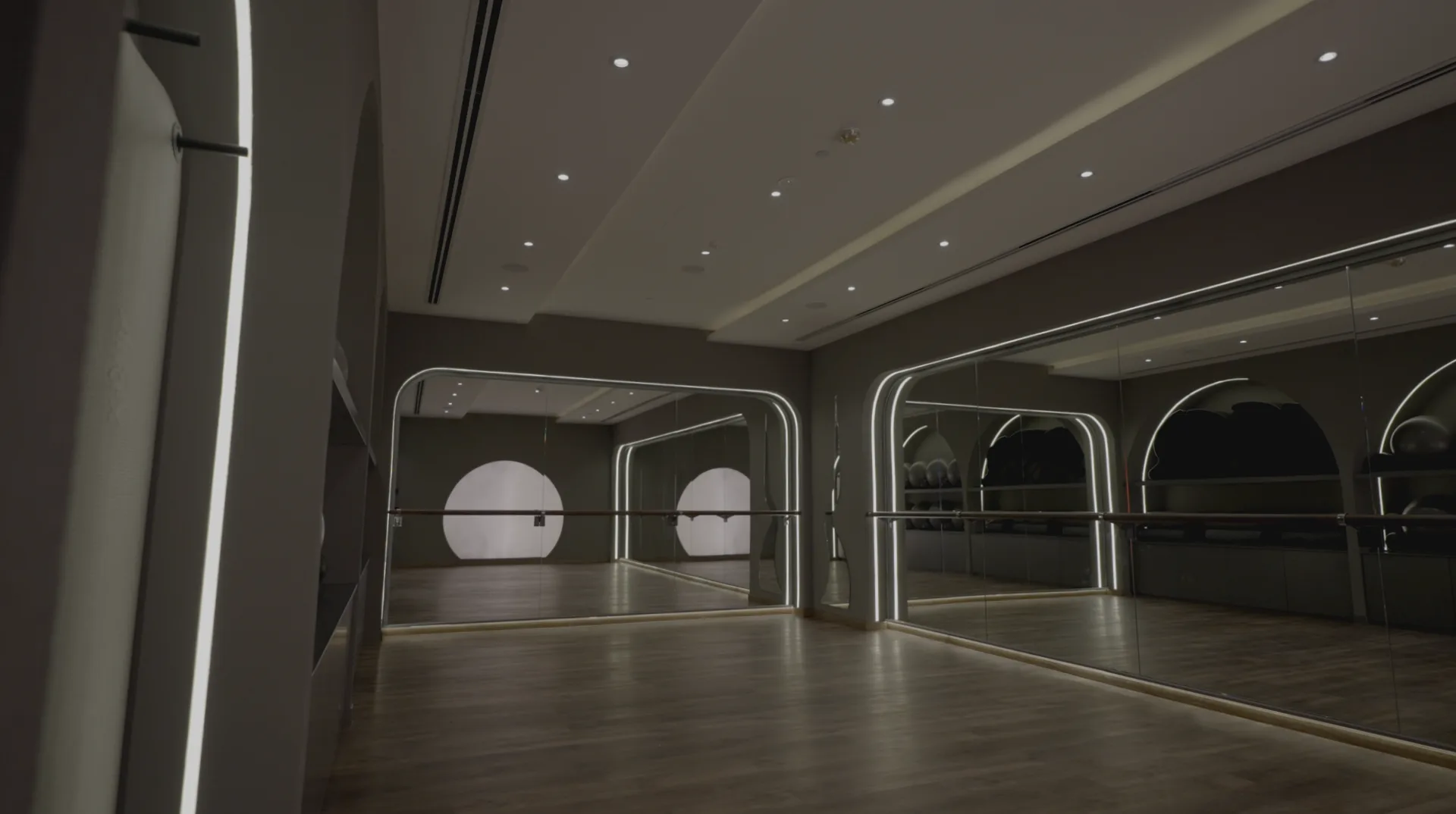 Wellness studio with arched mirrors and warm light