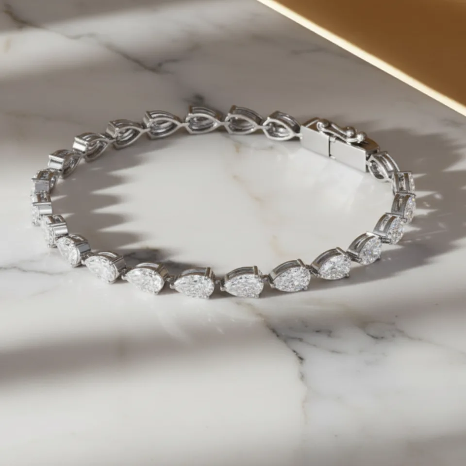 Pear-cut diamond line bracelet on marble