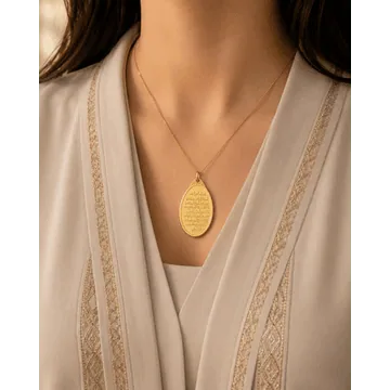 Model wearing a 1oz 24KT Ayatul Kursi gold pendant by FK Jewellers