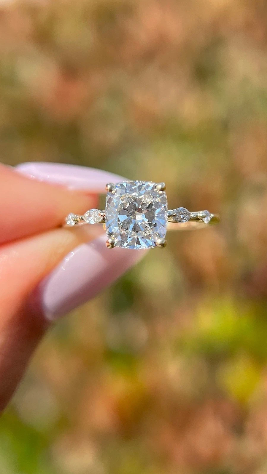 Cushion-cut diamond solitaire engagement ring in gold