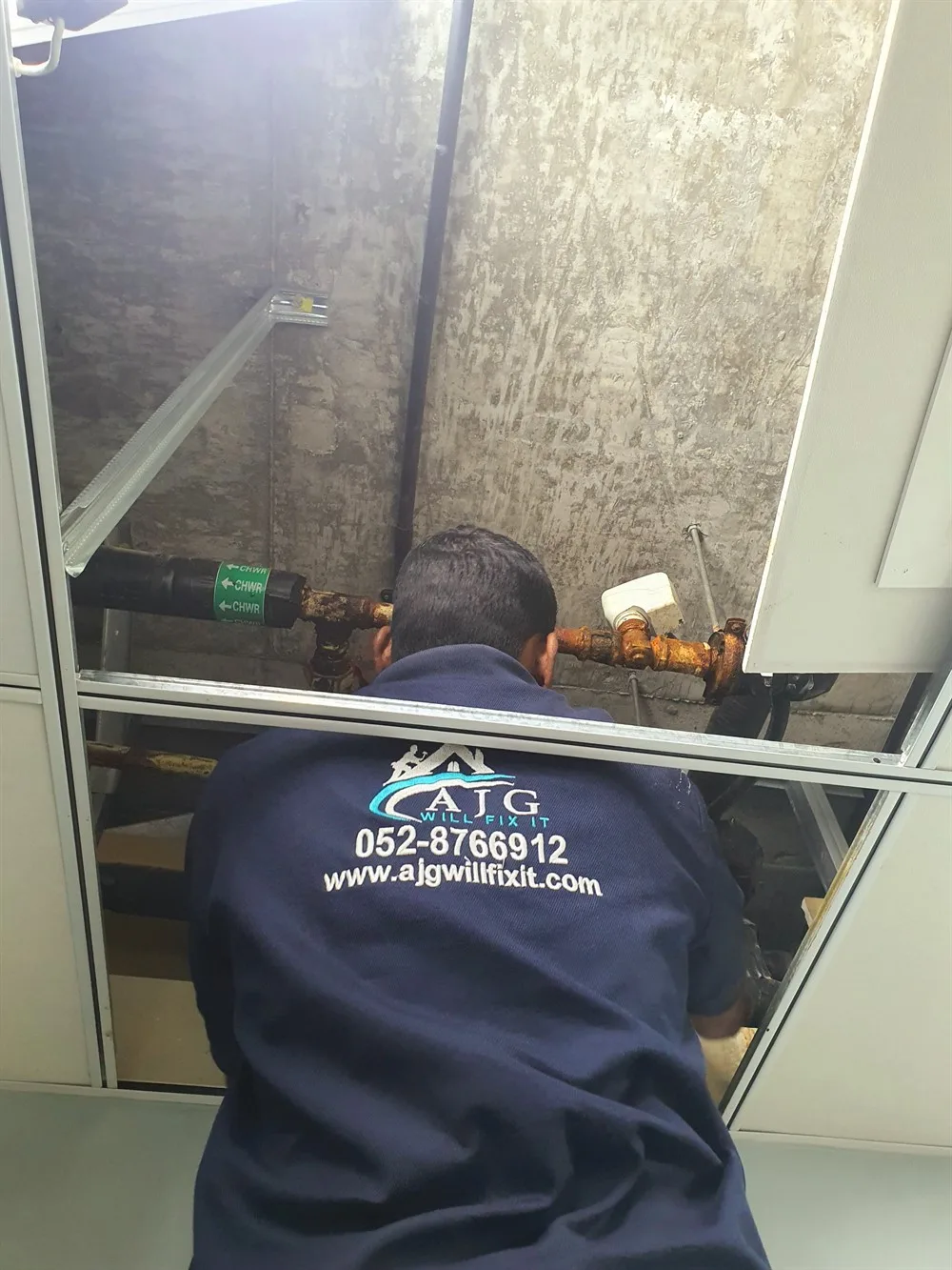 AJG technician working on chilled water pipework