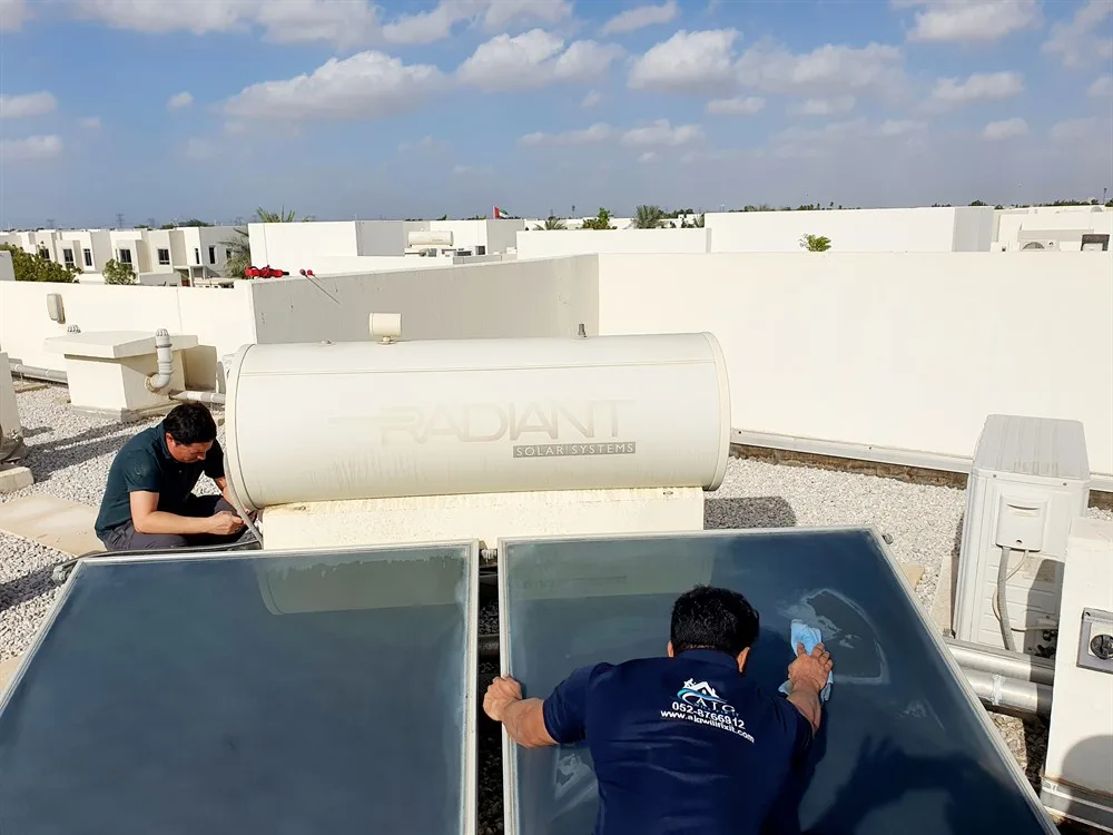 AJG team servicing a rooftop solar water heater