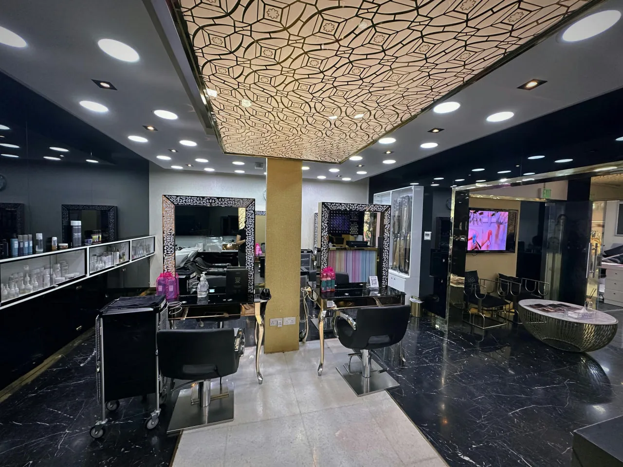 Inside an Afrina salon — styling stations and mirrors