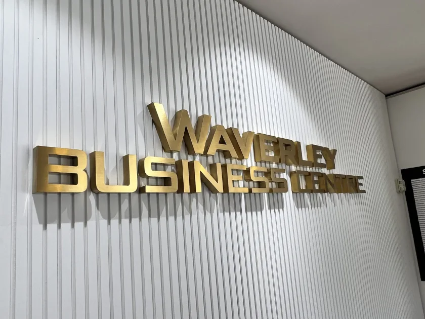 Polished brass fabricated lettering installed by Crown Sign