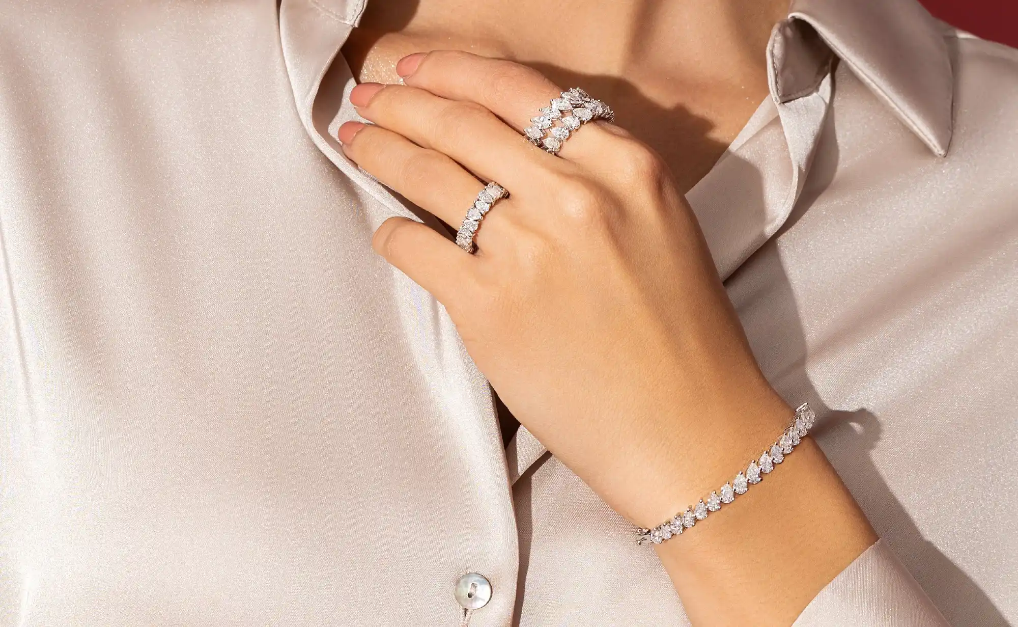 Solitaire Jewels gift boxes with diamond and emerald earrings on display