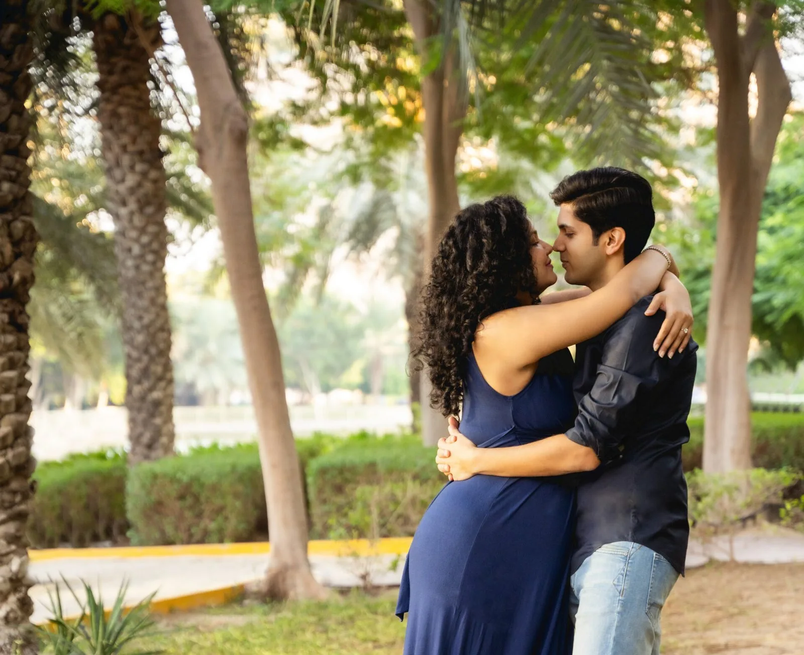 Couple embracing among the palms