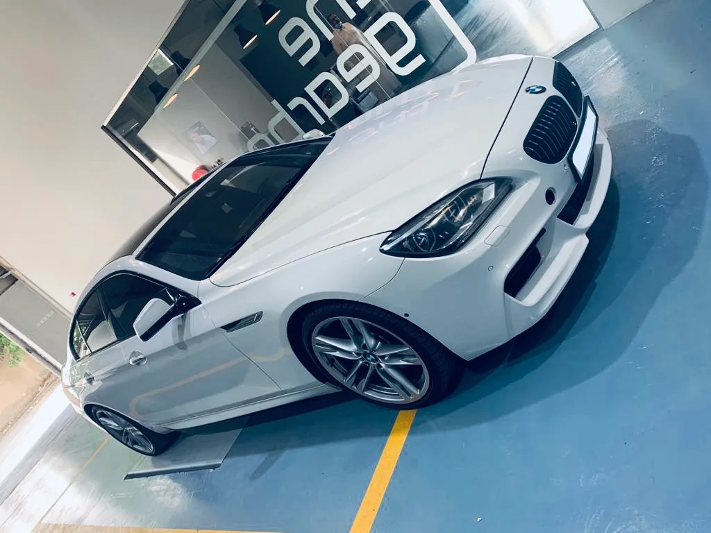 White BMW coupe on the bay markings
