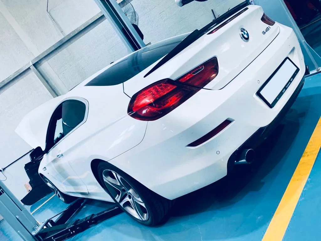 White BMW 6 Series convertible, rear three-quarter
