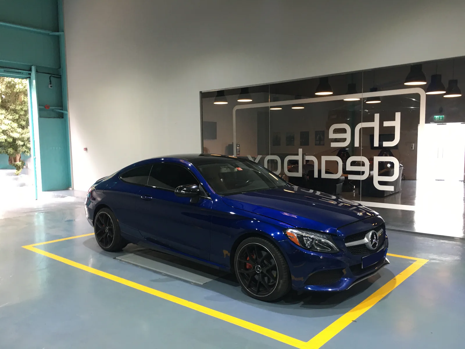 Blue Mercedes C-Class coupe in the bay