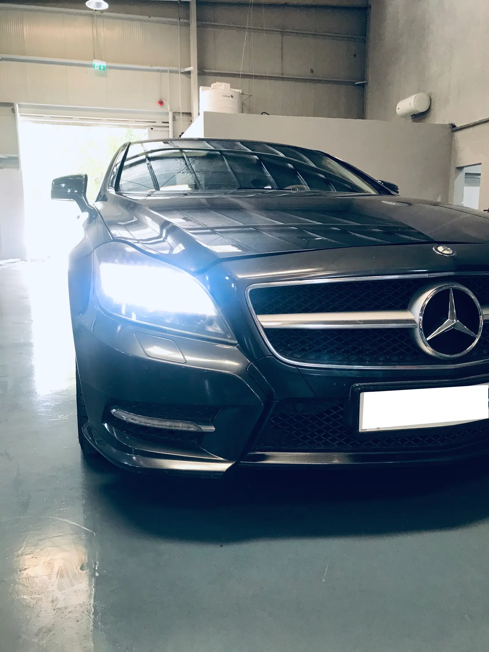 Dark Mercedes CLS front three-quarter