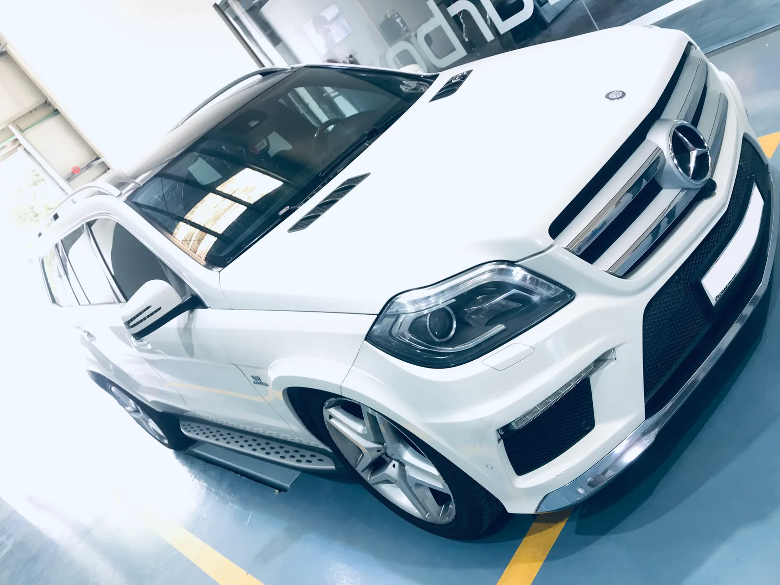 White wide-body Mercedes GL