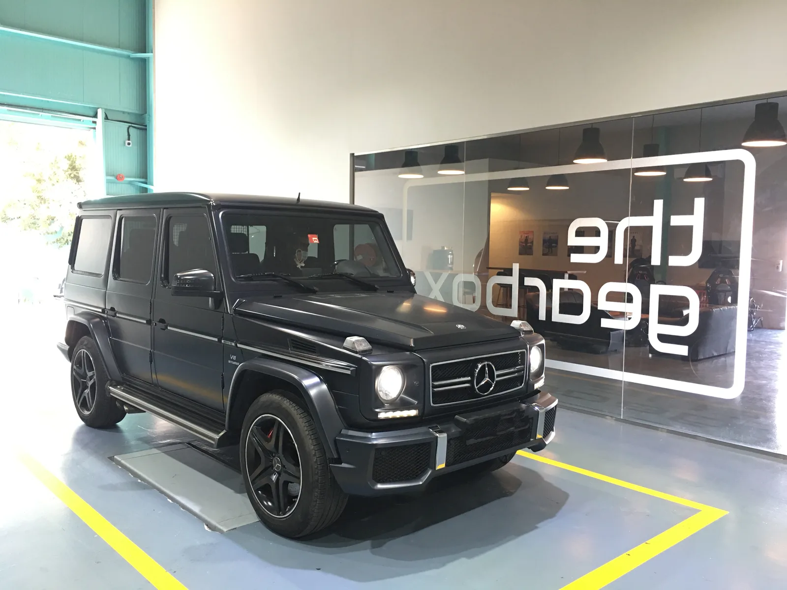 Silver Mercedes G-Wagon inside the gearbox workshop