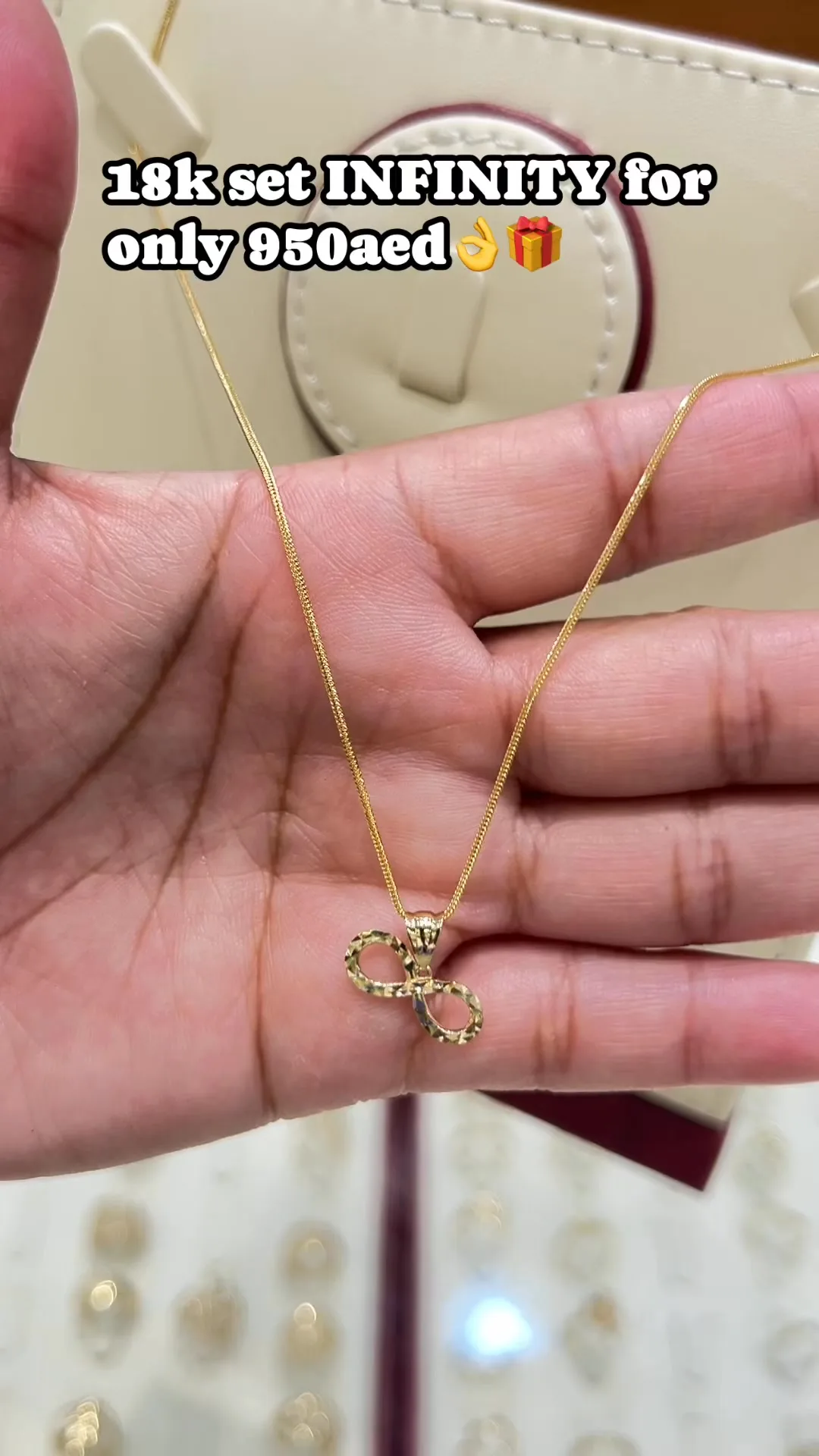 18k gold infinity pendant on a fine chain