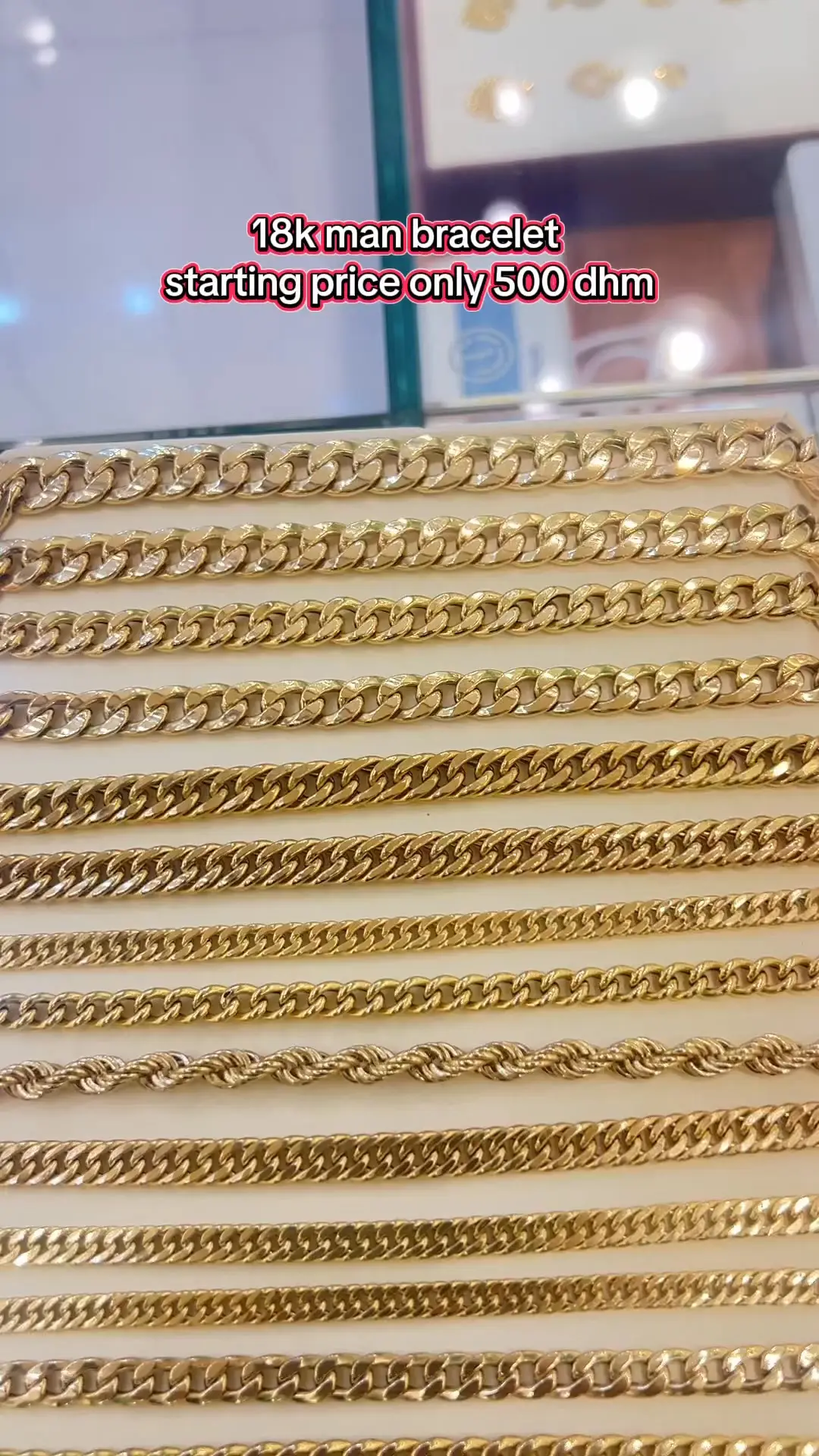 Row of 18k men's gold curb and rope bracelets