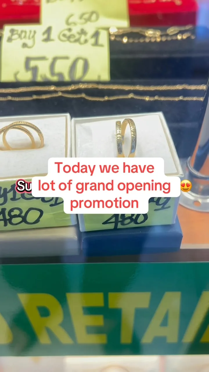 Gold rings displayed in gift boxes