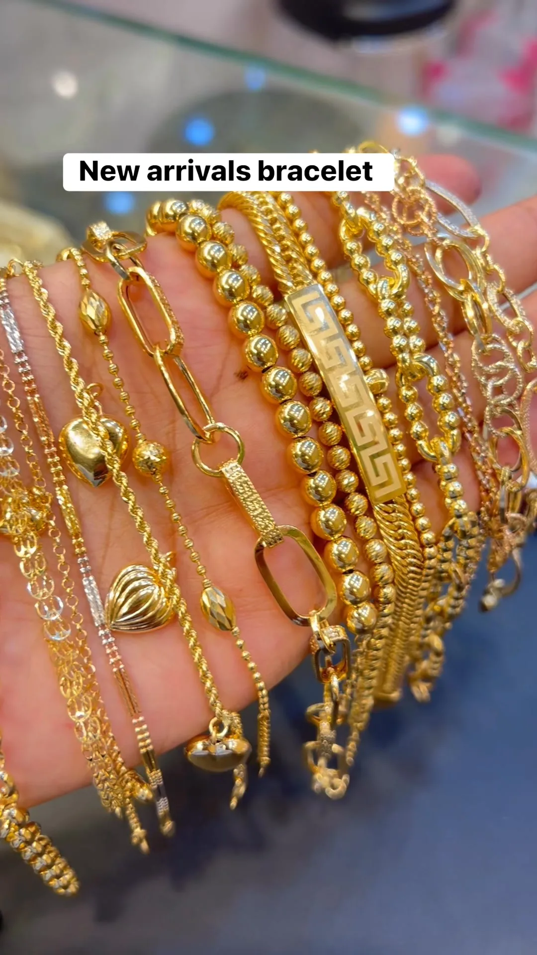 Assorted gold bracelets — beaded, rope and link styles