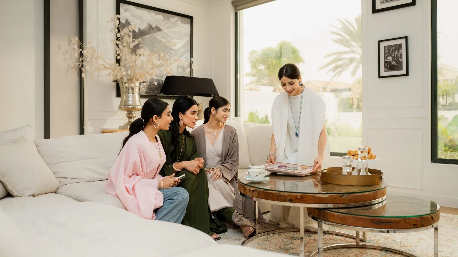 An Al Anwaar consultant presenting jewellery to clients in a private setting