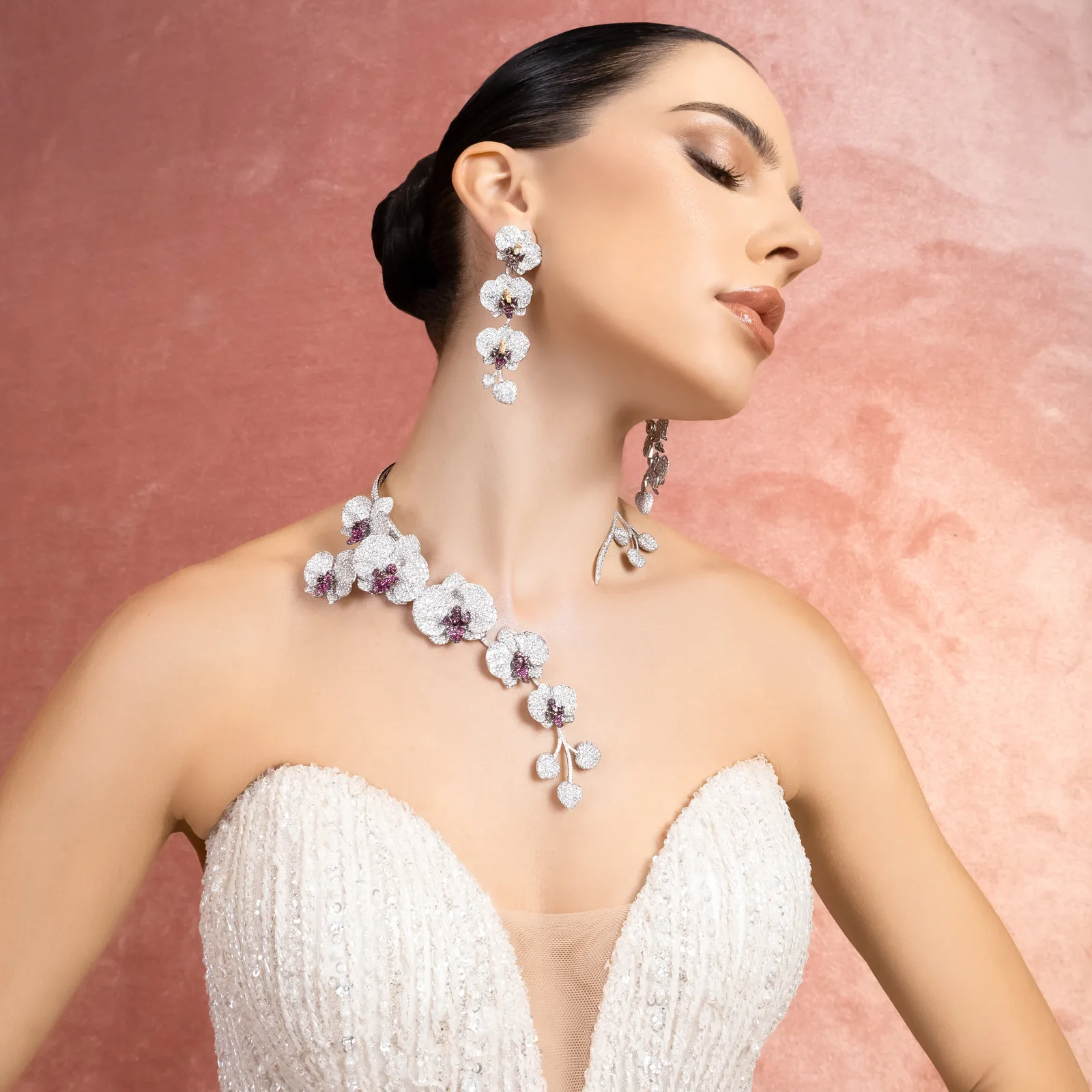Model in a bridal gown wearing the Al Anwaar Diamond Orchidée necklace and earrings