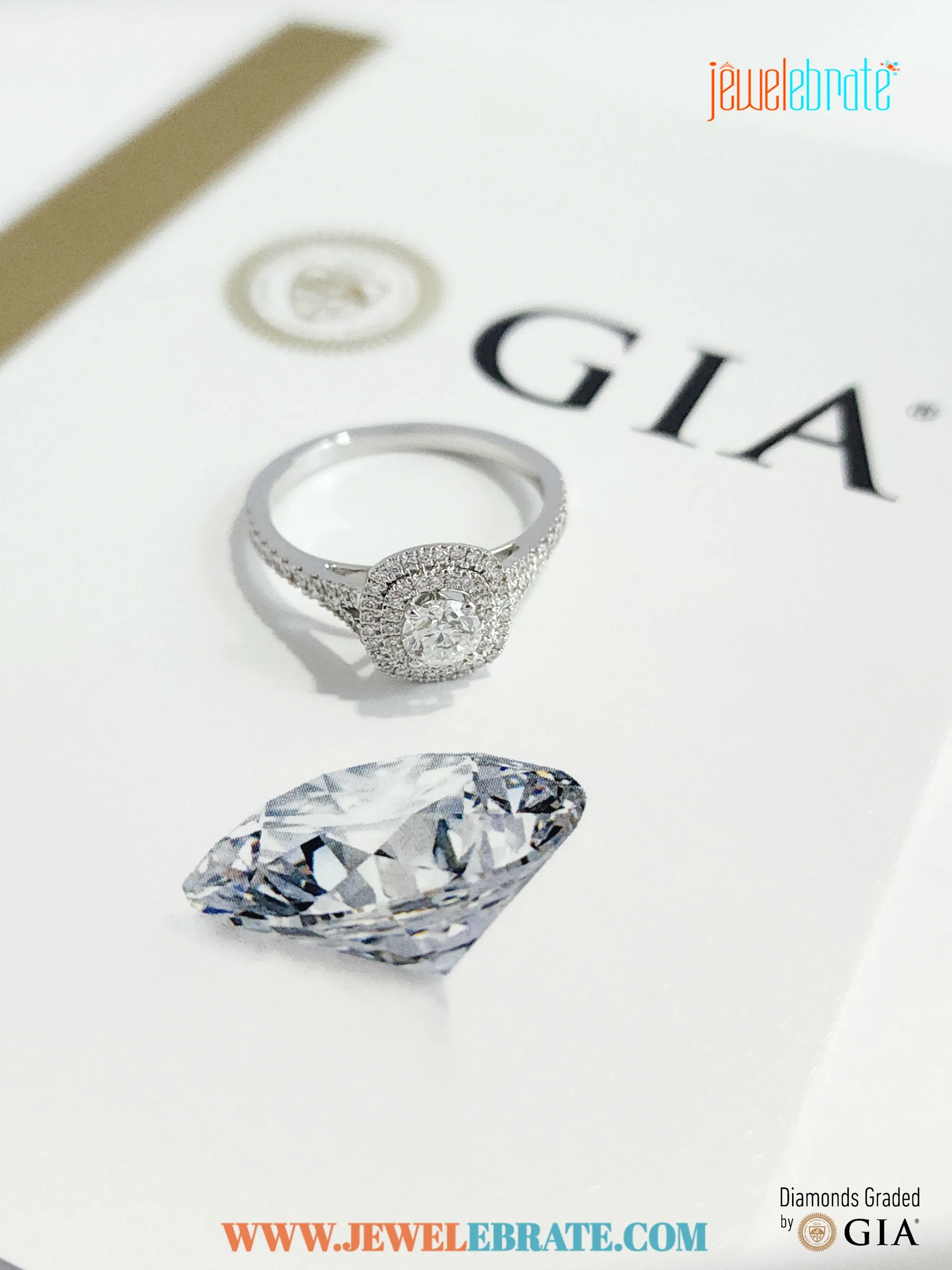 Round halo engagement ring on celadon silk.