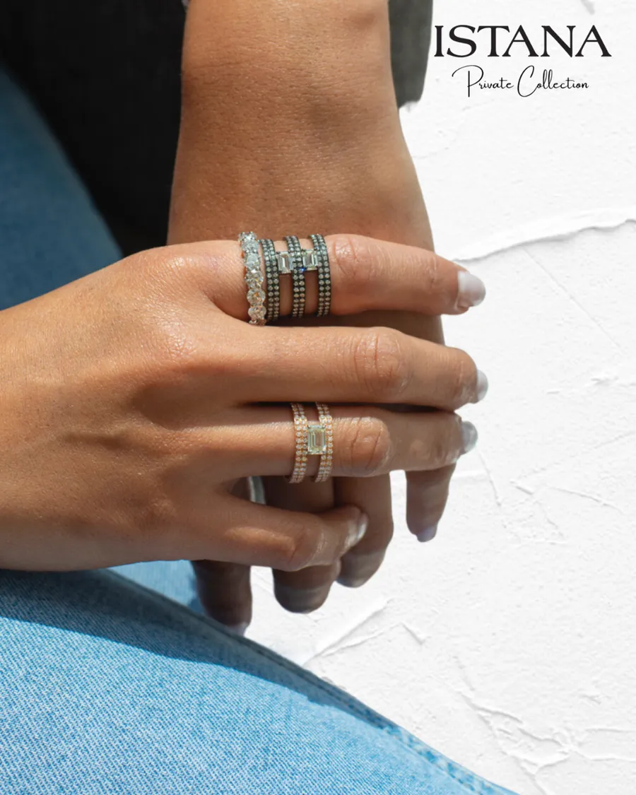 Diamond engagement and eternity rings worn together