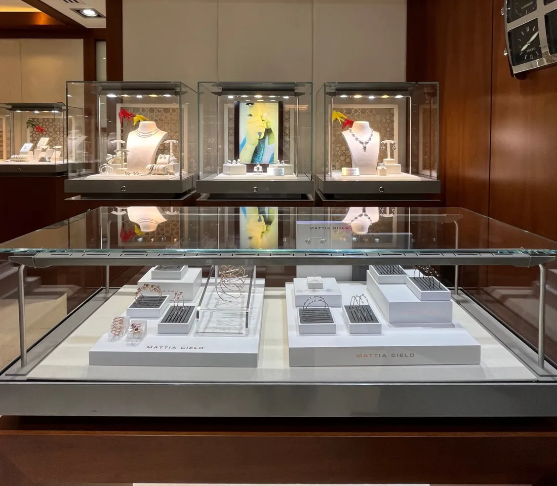 Illuminated display cases inside the ISTANA Four Seasons salon