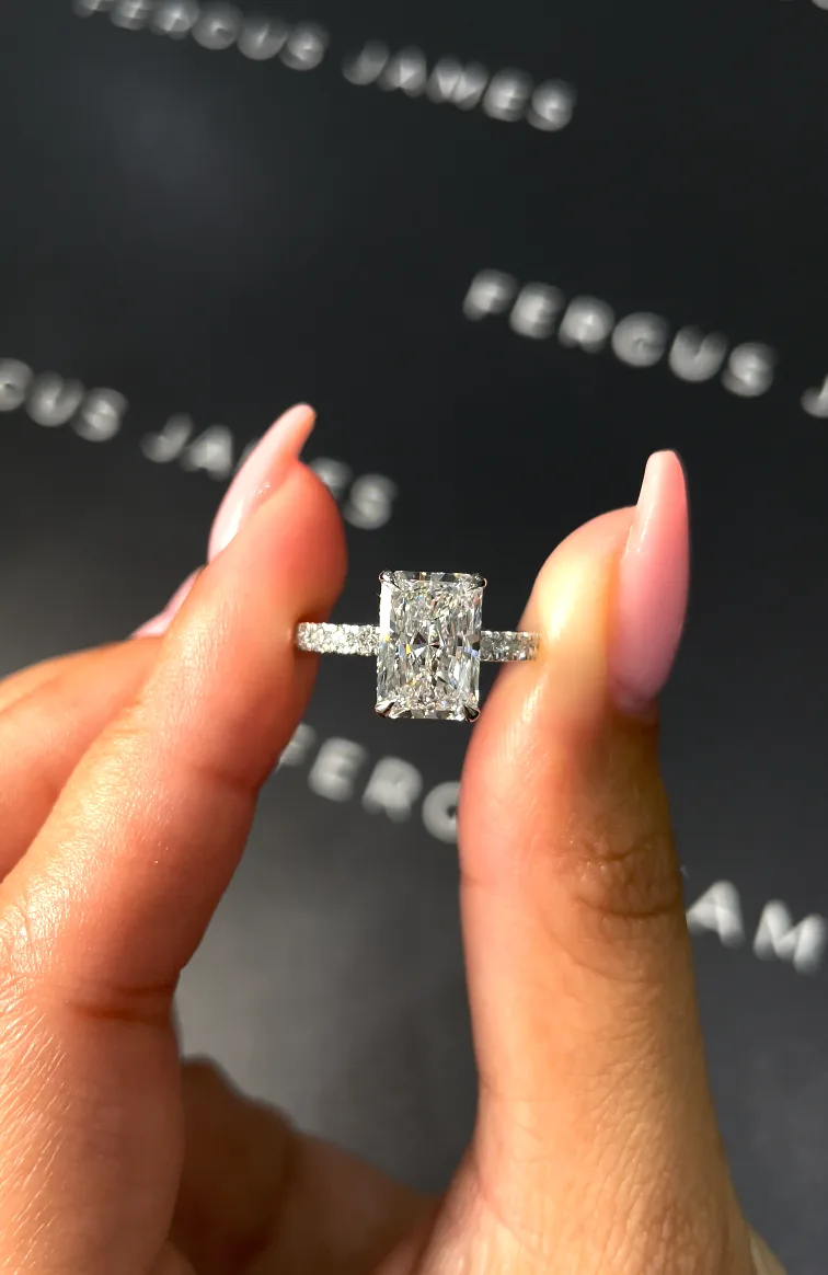 Bespoke emerald-cut diamond ring in yellow gold