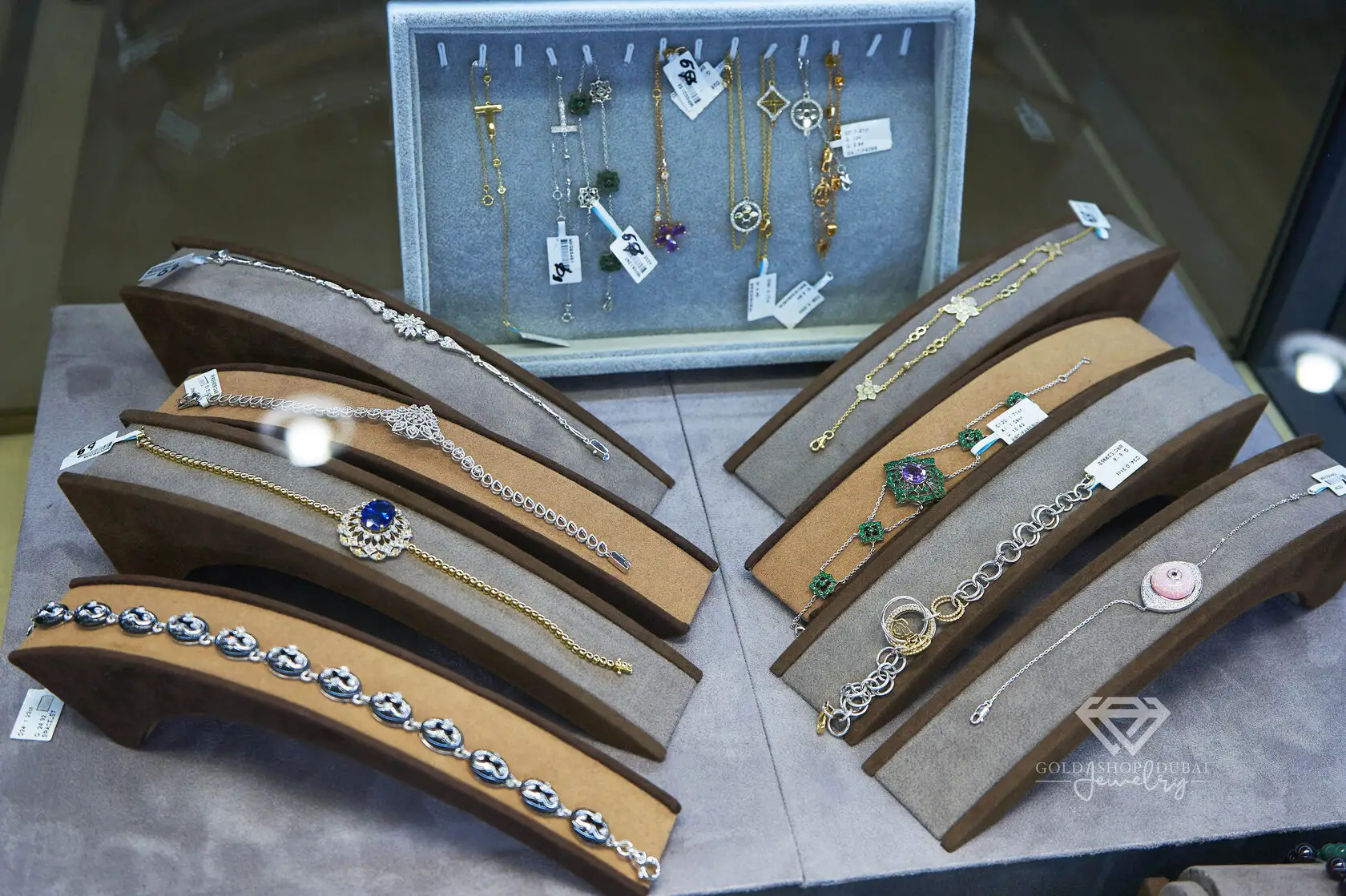 Diamond and gold bracelets on a display