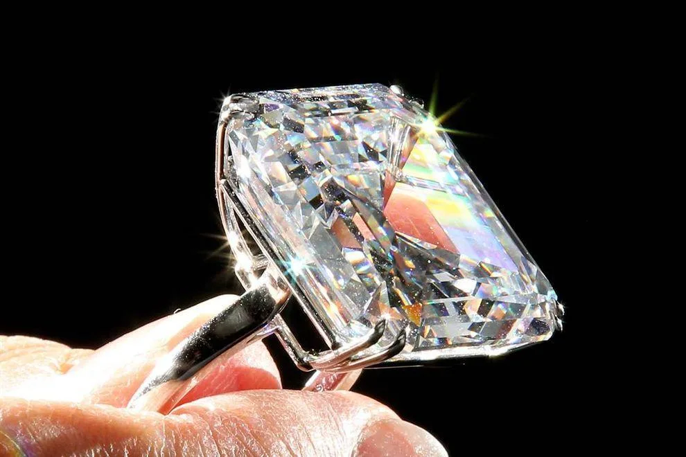 A large emerald-cut diamond ring catching the light