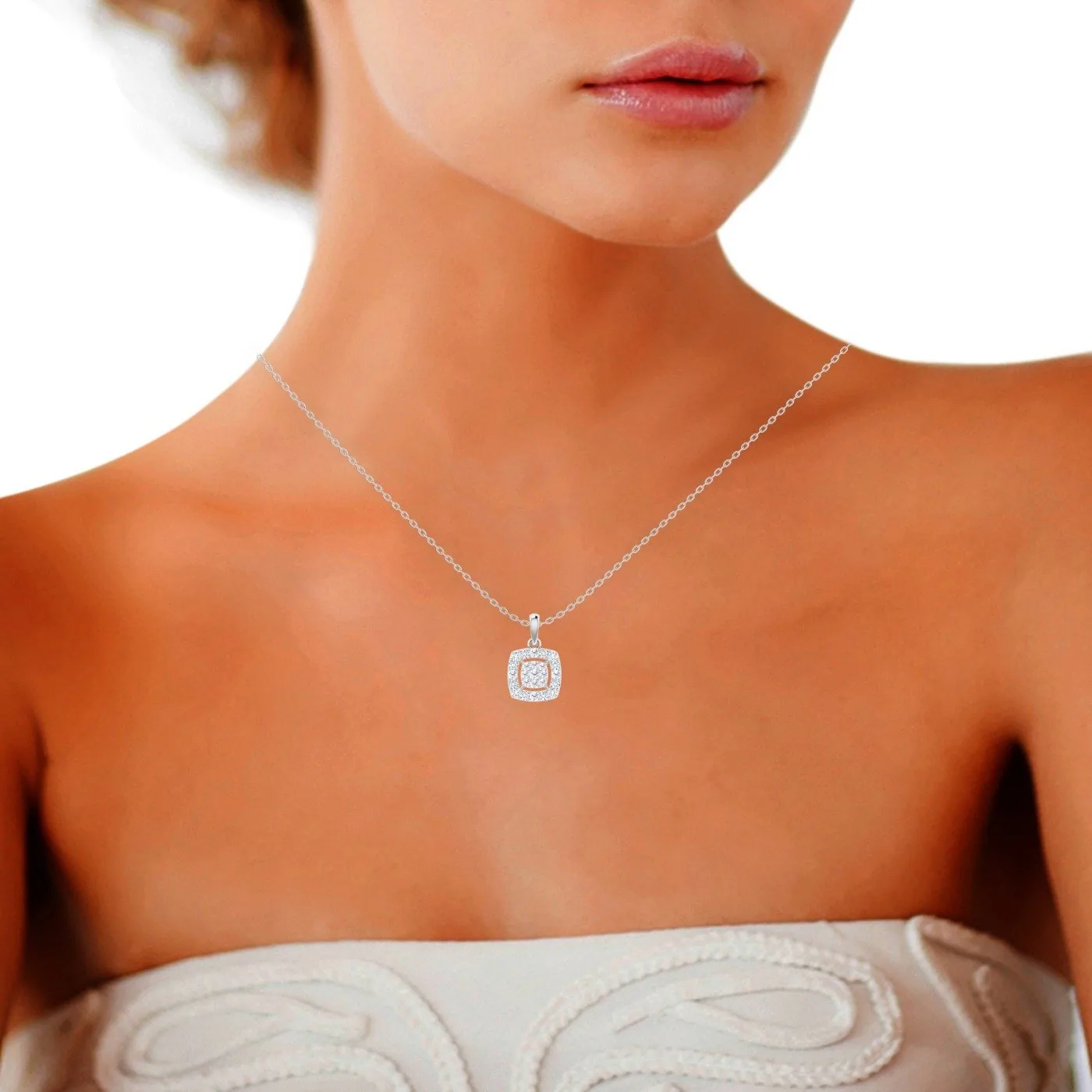 Cushion-halo diamond pendant worn at the neck