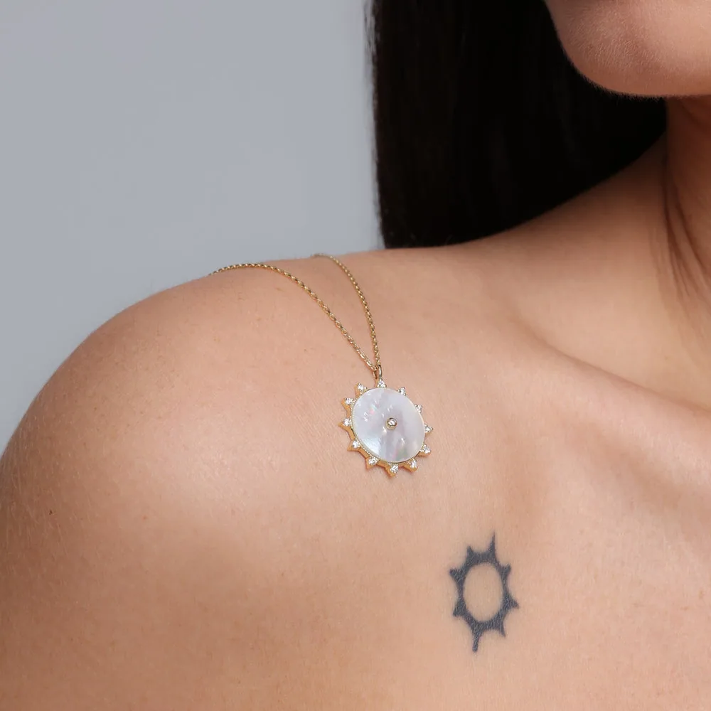 Mother-of-pearl medallion pendant on a fine gold chain
