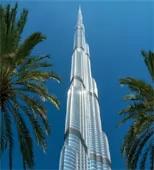Burj Khalifa rising above palm trees in Dubai