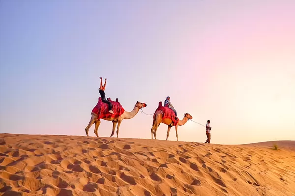 Dune-buggy desert safari at sunset