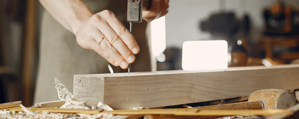 Craftsman working timber in the Modular Interiors carpentry workshop