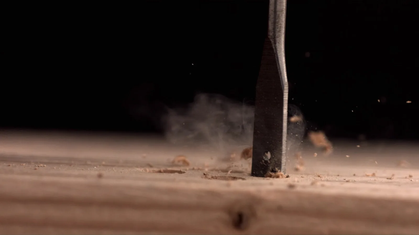 Ebonite joinery worker shaping a cabinet in the workshop