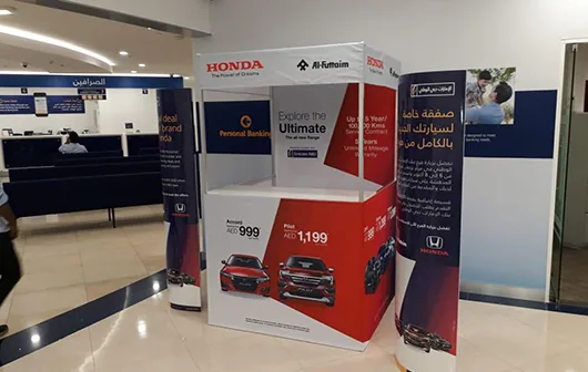 Custom branded fabric display stands inside a Honda showroom