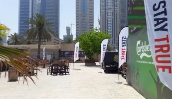 Curve-top feather flag printed with branding