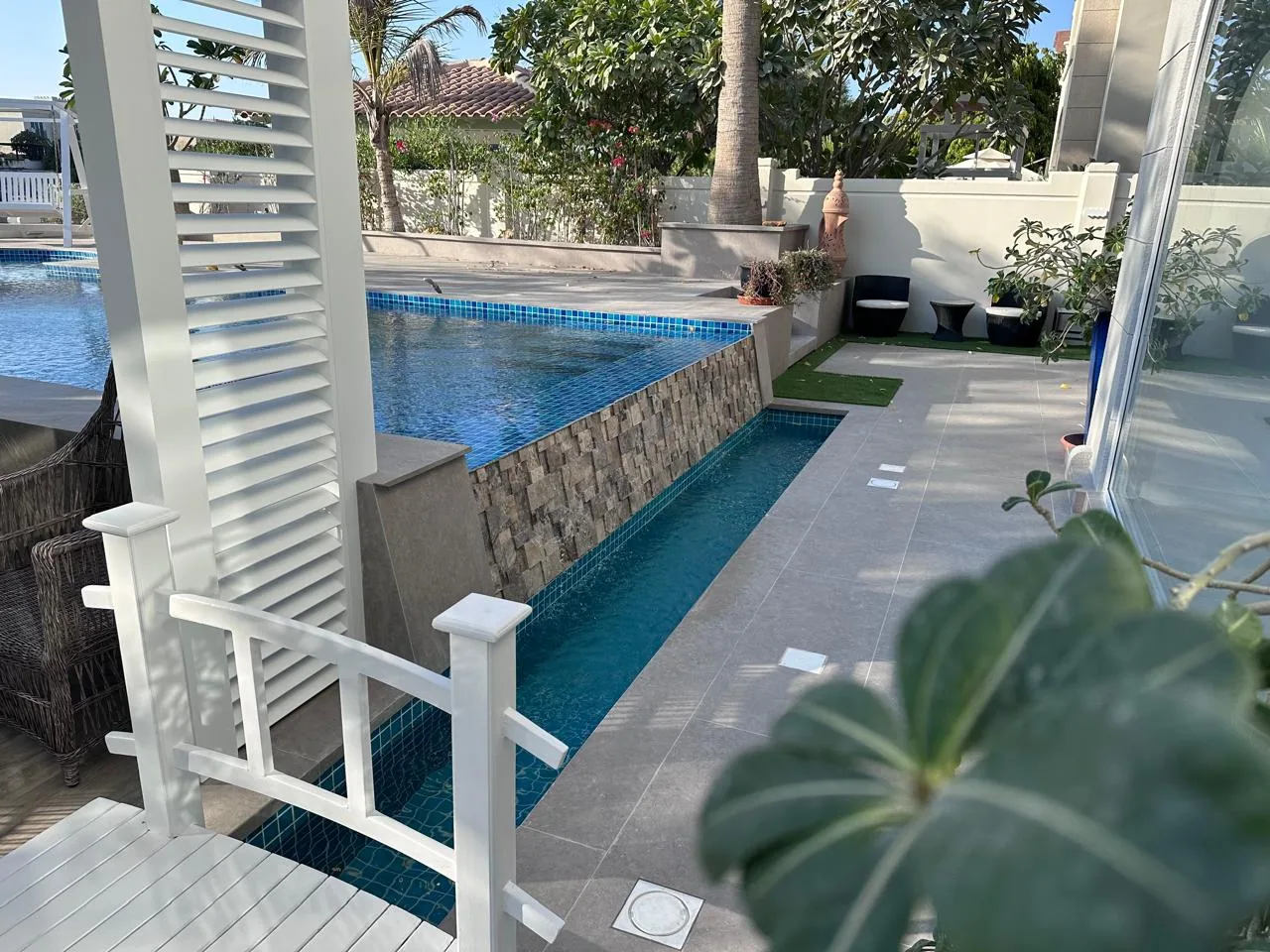 Outdoor living pavilion with pool and lounge