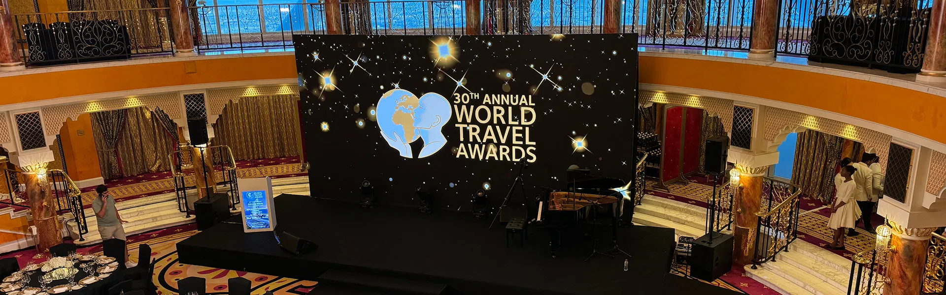 Awards-night stage with starfield LED backdrop and grand piano