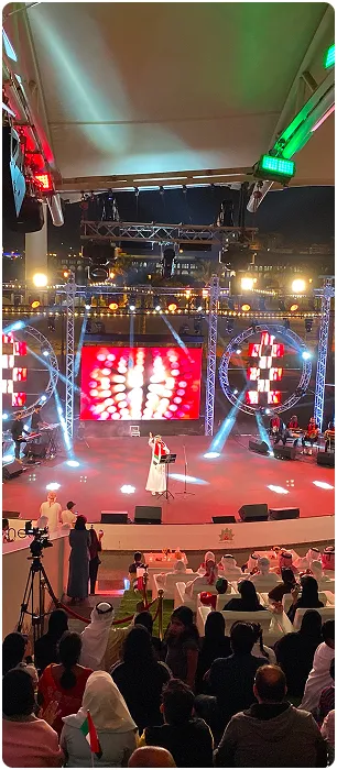 A large live event produced by Mramez Events with crowd, stage and LED screen