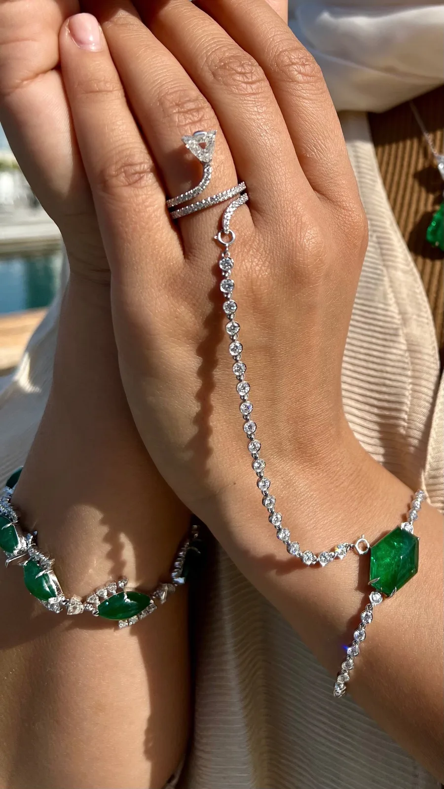 Diamond and emerald hand bracelet, worn